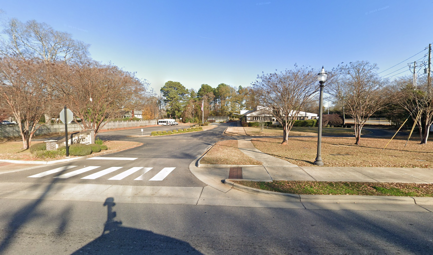 The Arc of Tuscaloosa County - recognizable features include an arched brick wall to the left of the entrance with the words "The Arc of Tuscaloosa County"