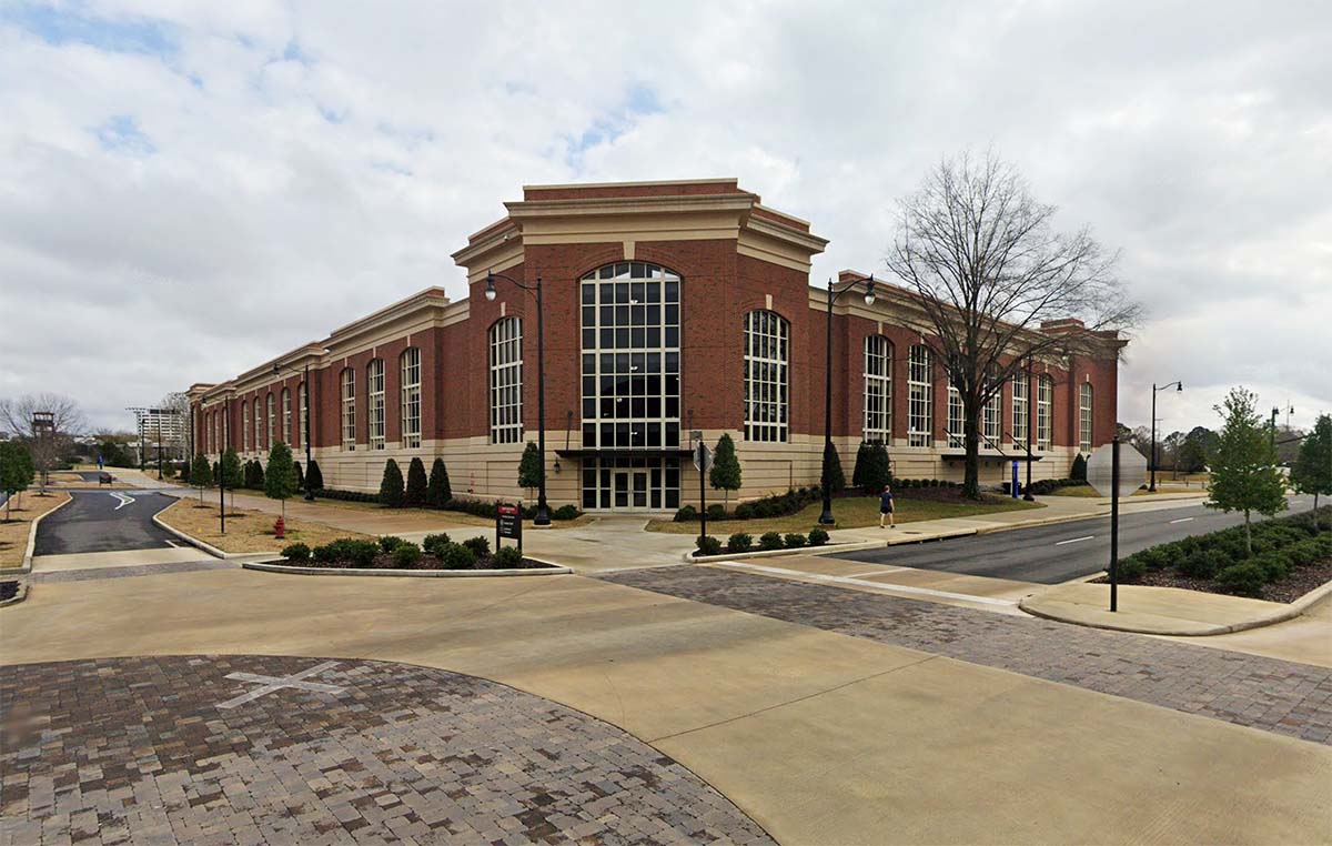 Capstone Deck - a 3-story parking deck with a white and red brick facade