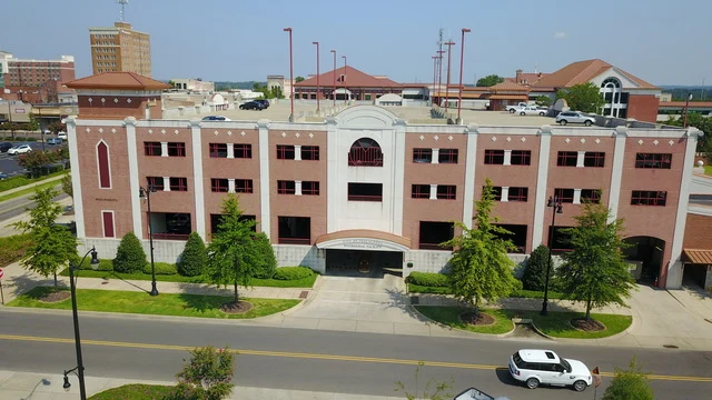 The Tuscaloosa Intermodal Facility - recognizable features include Government Plaza, a green space adjacent to the building.